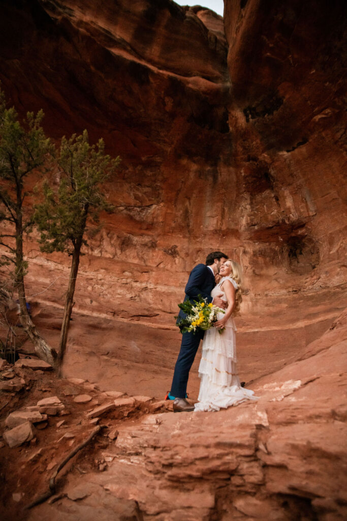 couple kissing during their sedona elopement 