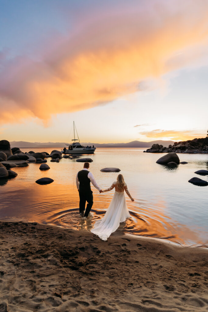 stunning couple getting inside the lake for their elopement photos