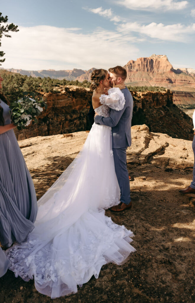 couple kissing after their intimate mountain elopement ceremony 