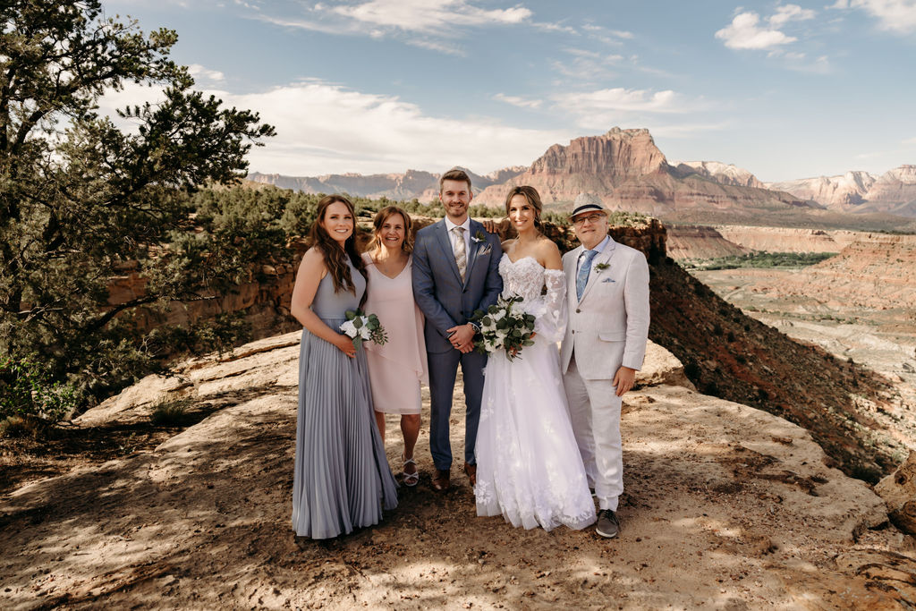 bride and groom with their in laws at their intimate mountain elopement
