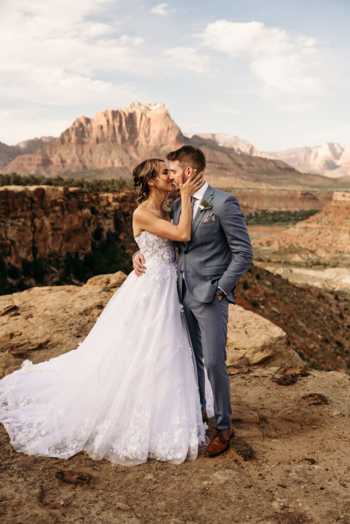 couple kissing at their intimate mountain wedding