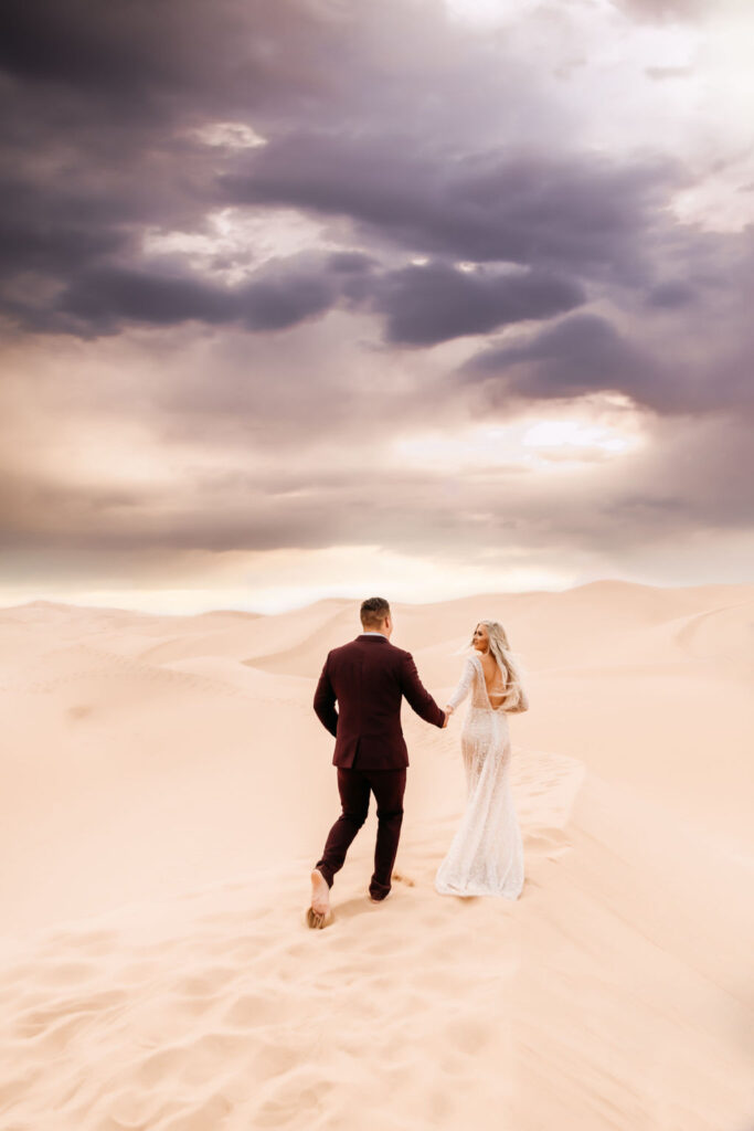 couple that elope in arizona holding hands during their photoshoot